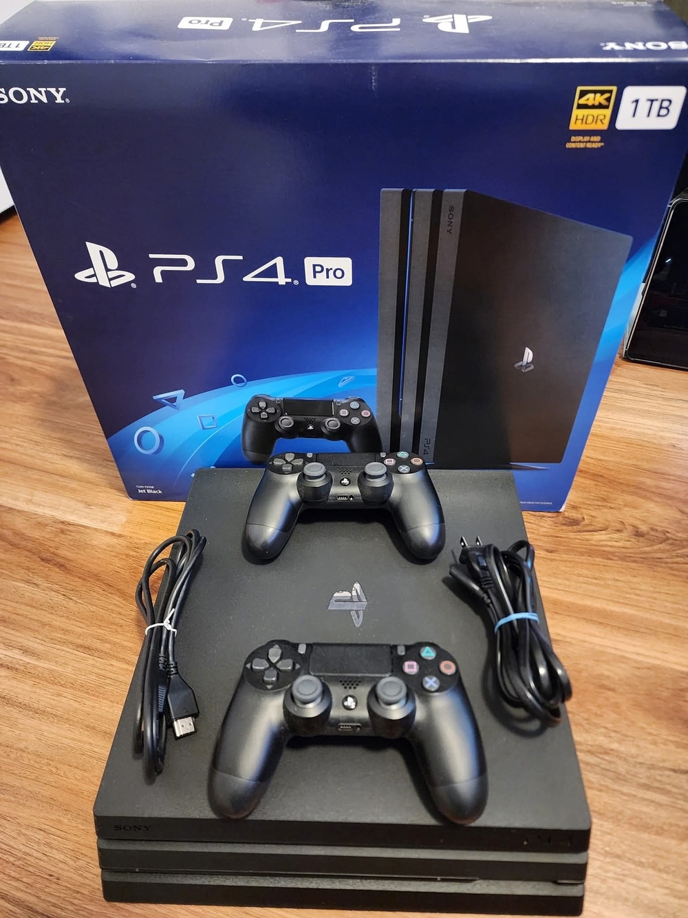 Sony PS4 Pro Console with Dual Black Controllers
